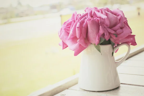 Vintage roses with vase — Stock Photo, Image