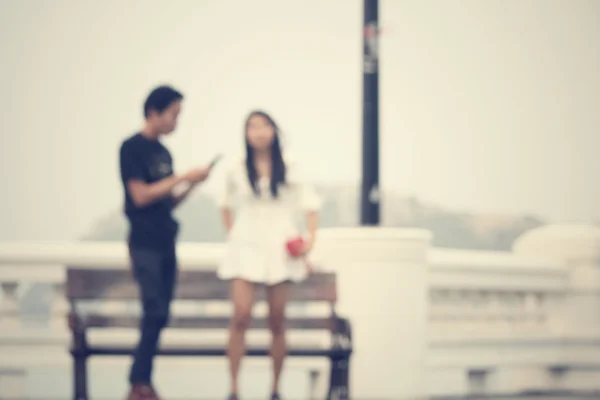 Blurred of love couple on bench — Stock Photo, Image