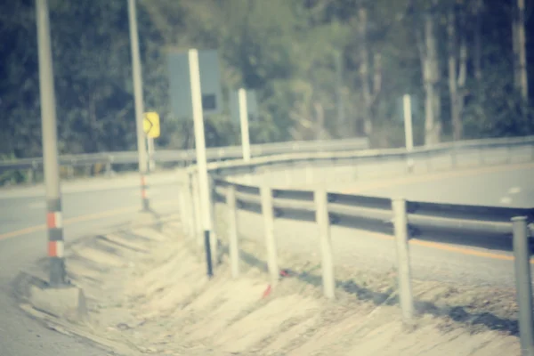 Blurred forest with road — Stock Photo, Image