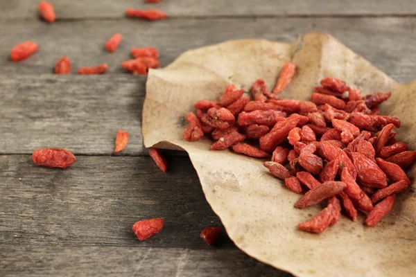 Dried goji berries on wood background — Stock Photo, Image