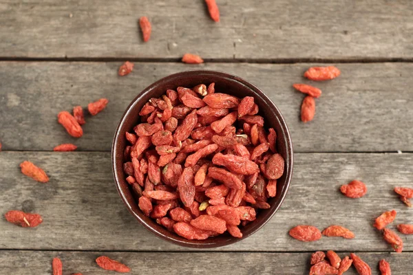 Dried goji berries on wood background — Stock Photo, Image