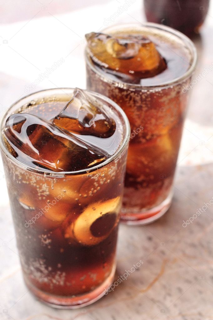 Glass of cola with ice cubes