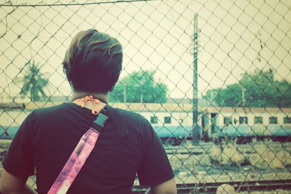 Woman behind at railway station — Stock Photo, Image