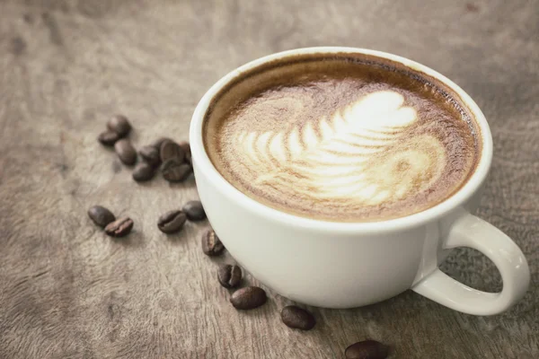 Vintage latte art coffee — Stock Photo, Image