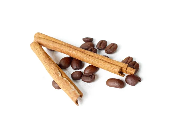 Roasted coffee beans and cinnamon — Stock Photo, Image