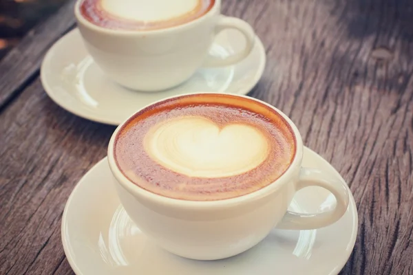 Two cups of latte art coffee — Stock Photo, Image