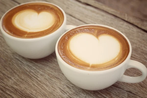 Two cups of latte art coffee — Stock Photo, Image