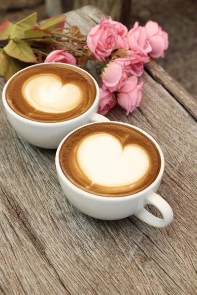 Two cups of latte art coffee — Stock Photo, Image