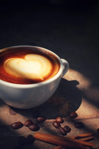 Vintage latte art coffee with shadow — Stock Photo, Image
