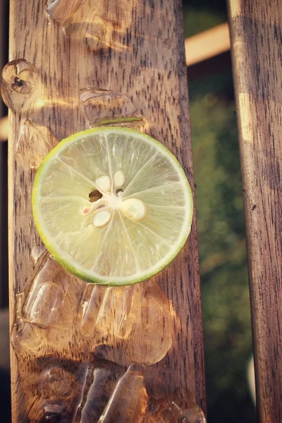 Slice of lemon with ice — Stock Photo, Image