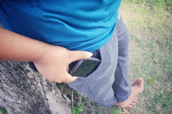 Teléfono inteligente en el bolsillo — Foto de Stock