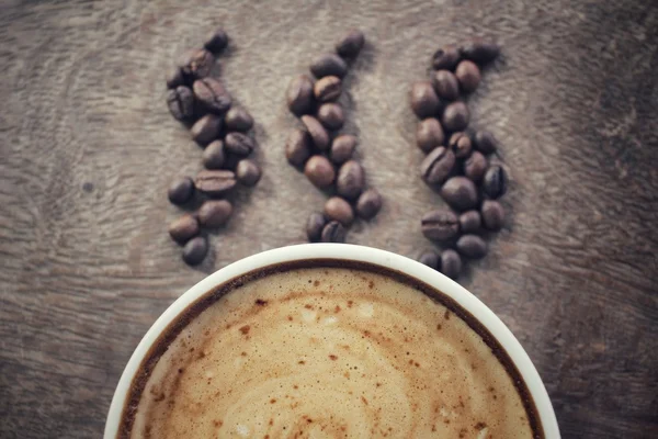 Latte coffee with beans — Stock Photo, Image