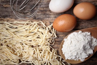 Making noodle with eggs and wheat flour clipart