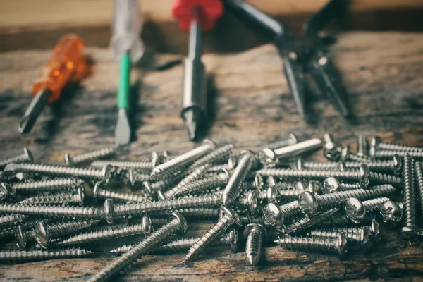 Screwdriver with screw — Stock Photo, Image