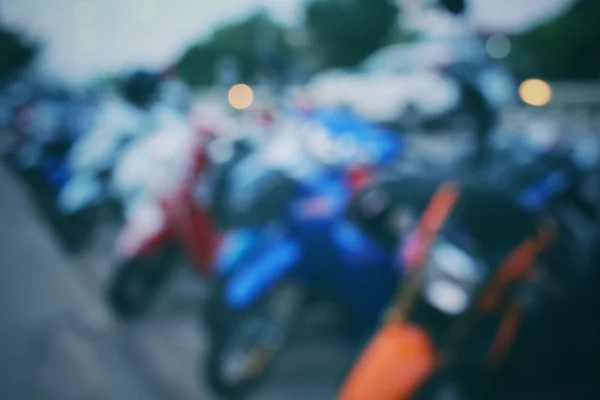 Borroso de motocicleta en la ciudad por la noche — Foto de Stock