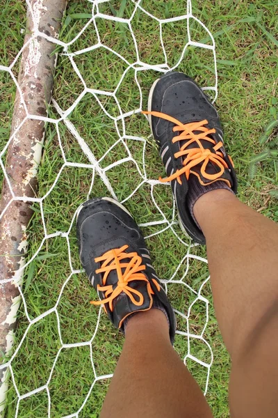 Selfie of sneakers on goal football — Stock Photo, Image