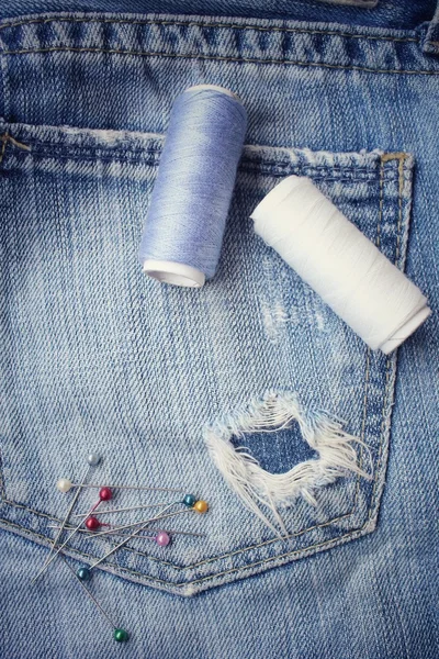 Bobbins threads on jeans — Stock Photo, Image