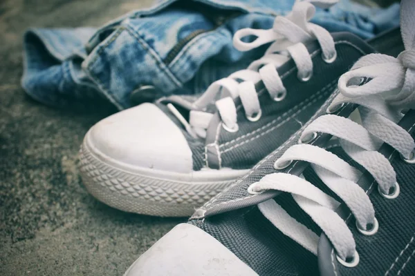 Sneakers with jeans — Stock Photo, Image