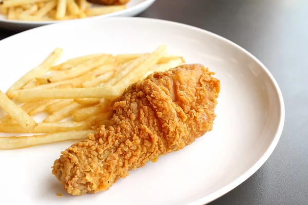 Fried chicken leg with french fries — Stock Photo, Image