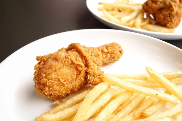 Fried chicken leg with french fries — Stock Photo, Image