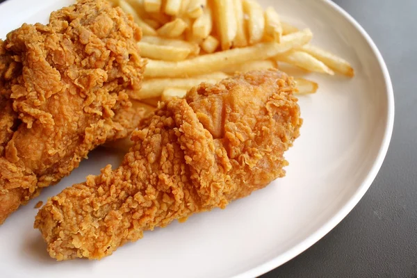 Fried chicken leg with french fries — Stock Photo, Image