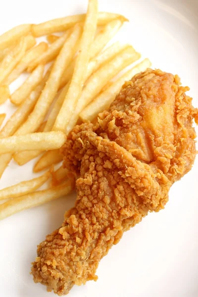 Fried chicken leg with french fries — Stock Photo, Image