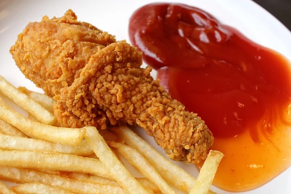 Fried chicken leg with french fries — Stock Photo, Image