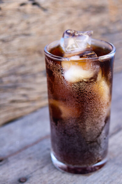 Soft drink cola with iced on glass