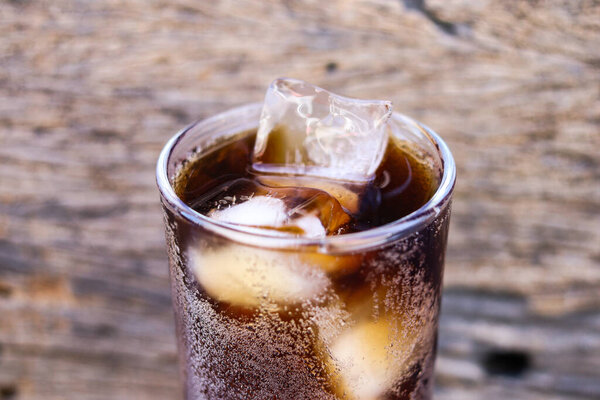 Soft drink cola with iced on glass