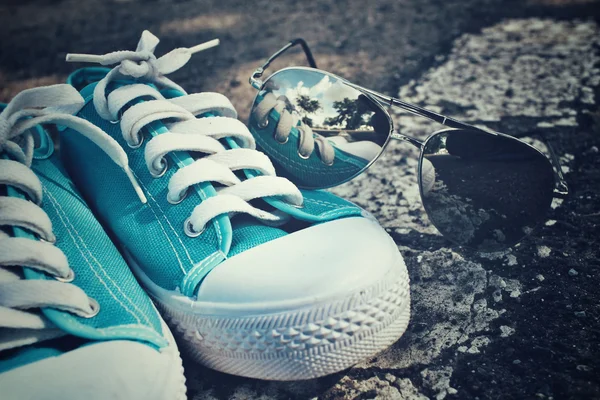 Sneakers with sun glasses — Stock Photo, Image