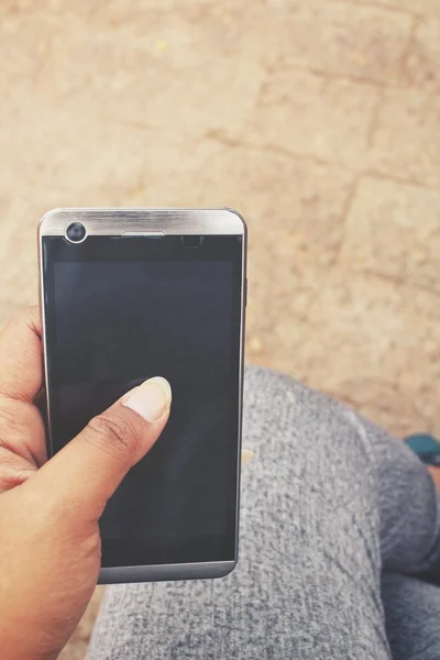 Selfie av smarta telefonen på hand med skor — Stockfoto