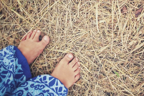 Selfie of feet on dried grass — Stock Photo, Image