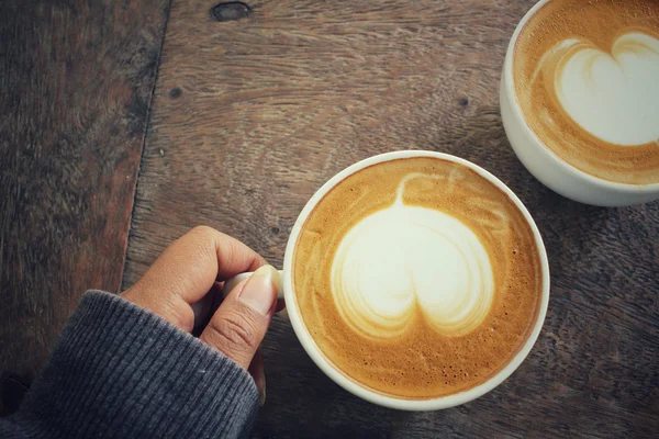 Two cups of latte art coffee — Stock Photo, Image