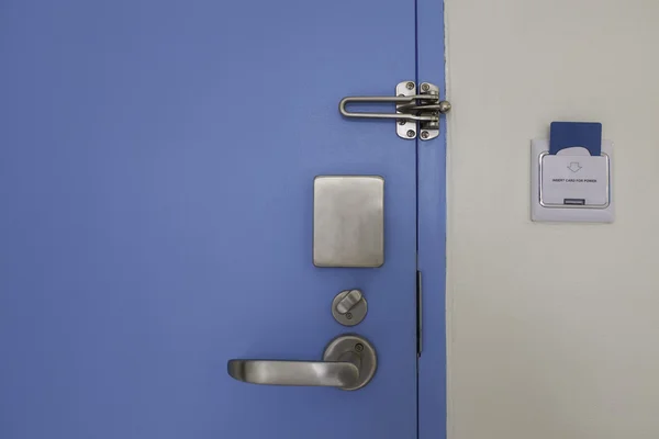 Door with stainless steel lock set and access control card — Stock Photo, Image