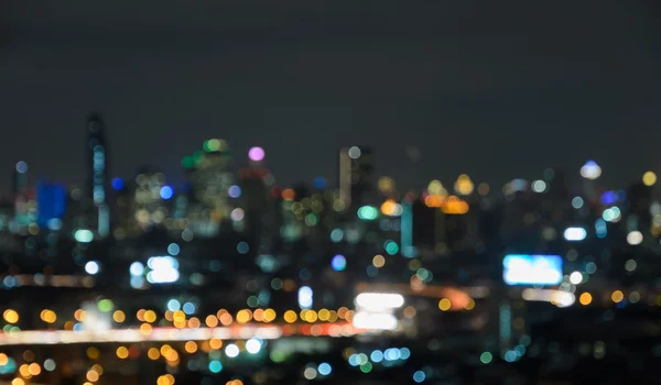在黄昏时分的城市天际线的鸟瞰图。模糊的城市景观酒泉 — 图库照片