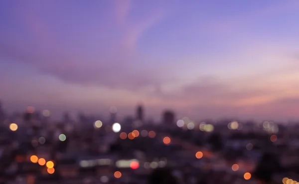 Blurred city lights bokeh illuminate at twilight — Stock Photo, Image