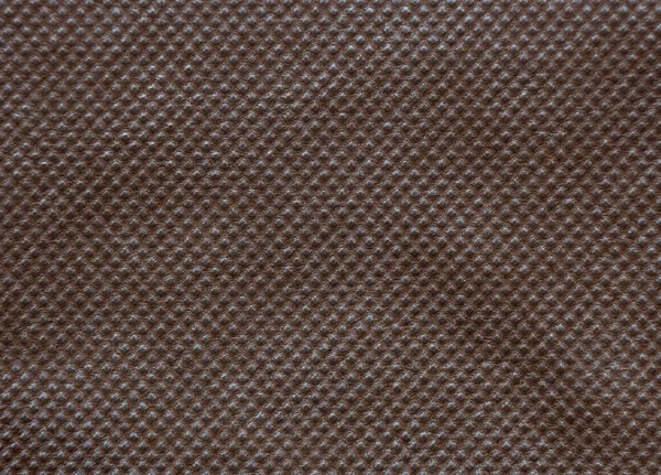非织造布或弹力粘结织物的褐色纹理背景 — 图库照片