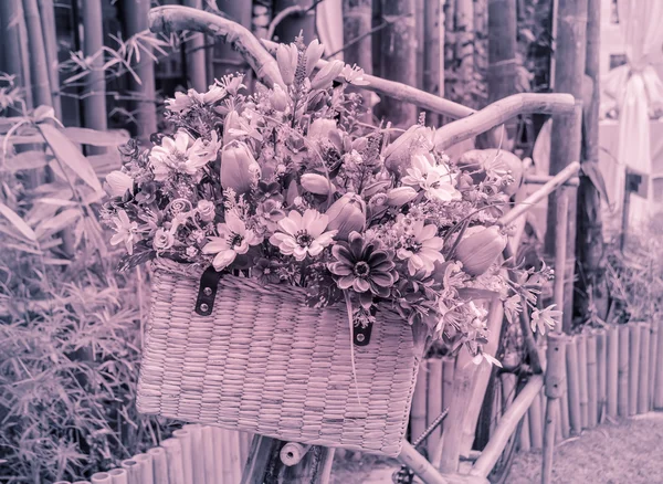 Vintage wooden bicycle with flowers — Stock Photo, Image