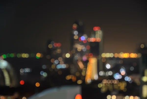Blurred city lights bokeh illuminated at night — Stock Photo, Image