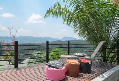 Outdoor patio with mountain view in Thailand clipart