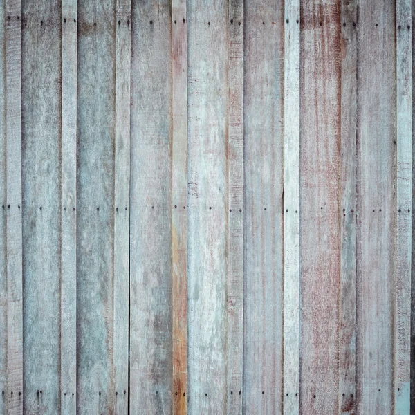 Mur en bois avec le fond martelé des ongles rouillés — Photo