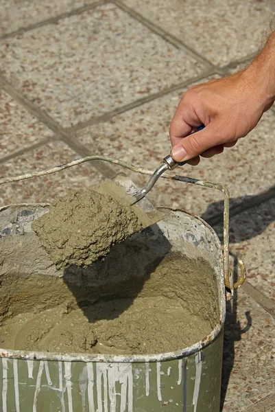 Mason with bucket cement — Stock Photo, Image