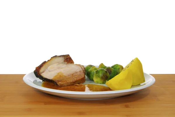 Asado de cerdo en plato blanco — Foto de Stock