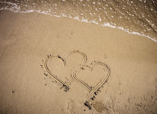 Schrijven op het zand — Stockfoto