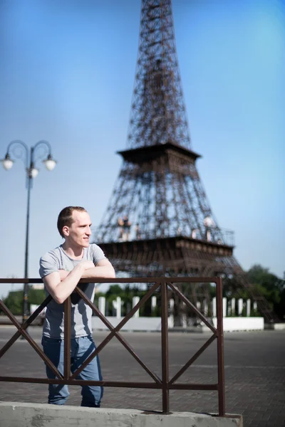 Boy on a background copy of the Eiffel Tower — Stock Photo, Image