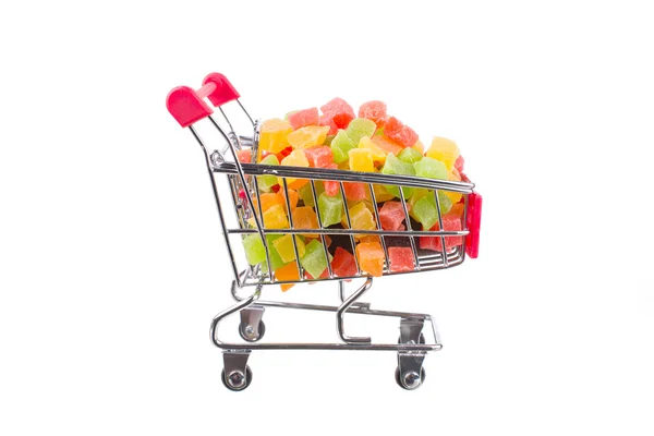 Egy csomó-ból egy bevásárló kocsi kandírozott gyümölcs — Stock Fotó