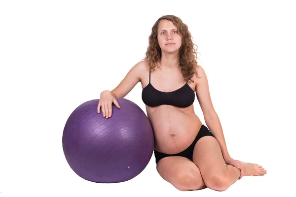 Pregnant woman excercises with gymnastic ball — Stock Photo, Image