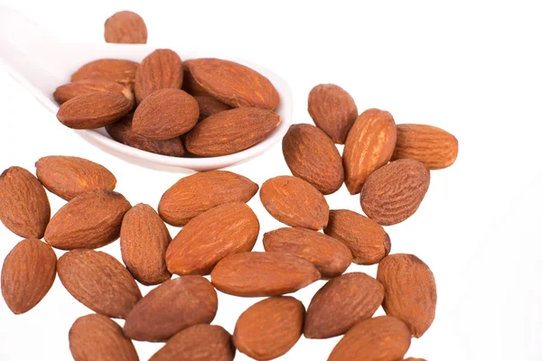 Almonds kernel in a wooden plate — Stock Photo, Image