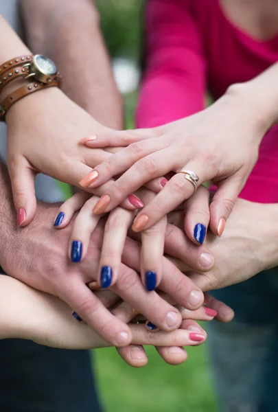 Hands in. Closeup of pile of hands of a business team showing unity