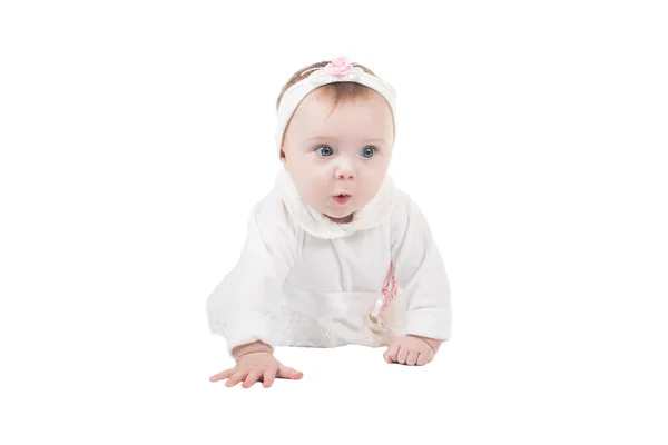 Side view of pretty baby girl crawling on floor on  isolated studio on white background — Stock Photo, Image